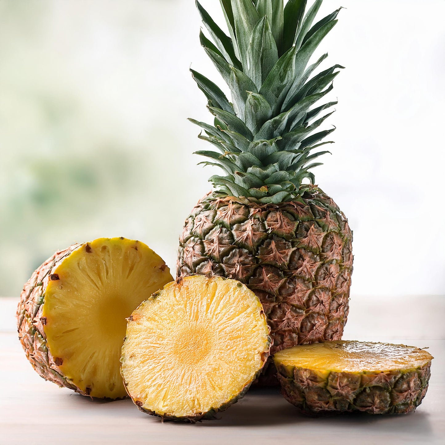 Fresh whole and sliced pineapple used to inspire Galaxy Flavours Pineapple Food Flavouring Concentrate – Professional Grade, Water-Soluble