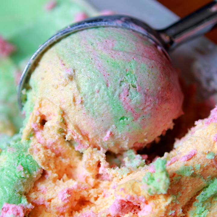 Colourful rainbow sherbet sweets used to inspire Galaxy Flavours Rainbow Sherbet Food Flavouring Concentrate – Professional Grade, Water-Soluble